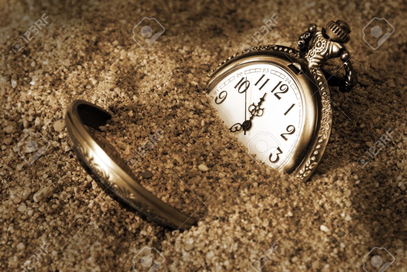 https://vegardkildal.files.wordpress.com/2015/12/10507416-a-pocket-watch-is-buried-in-the-dirty-sand-stock-photo-clock-time-sand.jpg